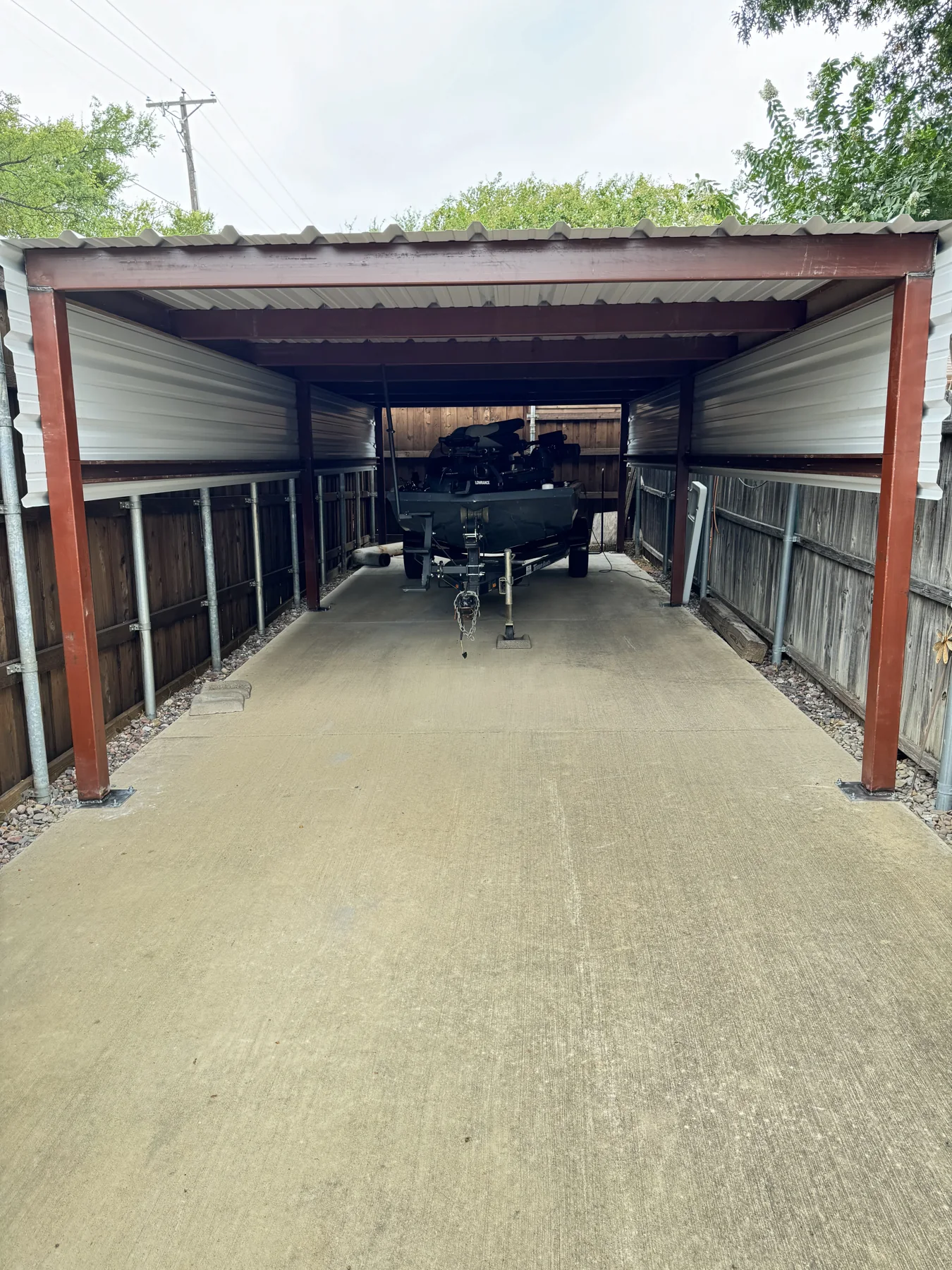 Welded red iron framing under metal roof